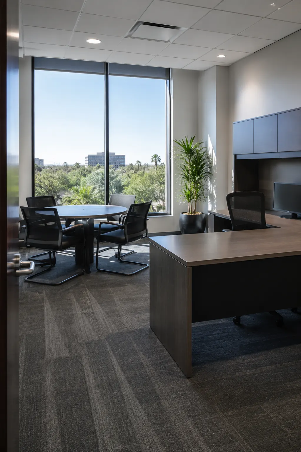 An open-plan office with clear desks and clean flooring